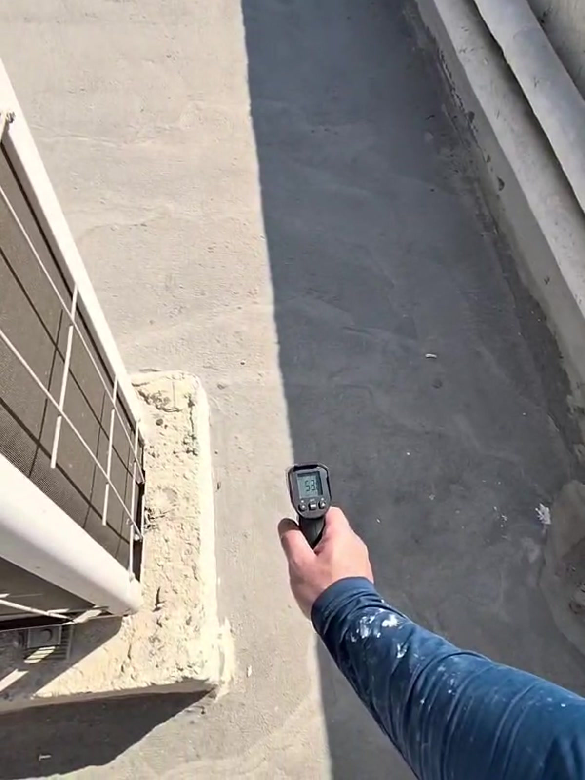 CoolRoof UAE roof temperature proof showing reflective surface much cooler than untreated roof