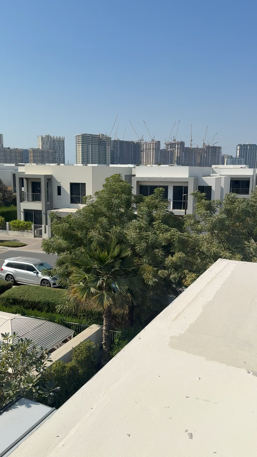 Completed white reflective roof after cool-roof treatment